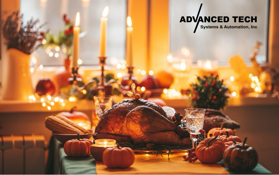 Picture of a turkey on a Thanksgiving dinner table with the Advanced Tech Systems & Automation logo in the right top corner.